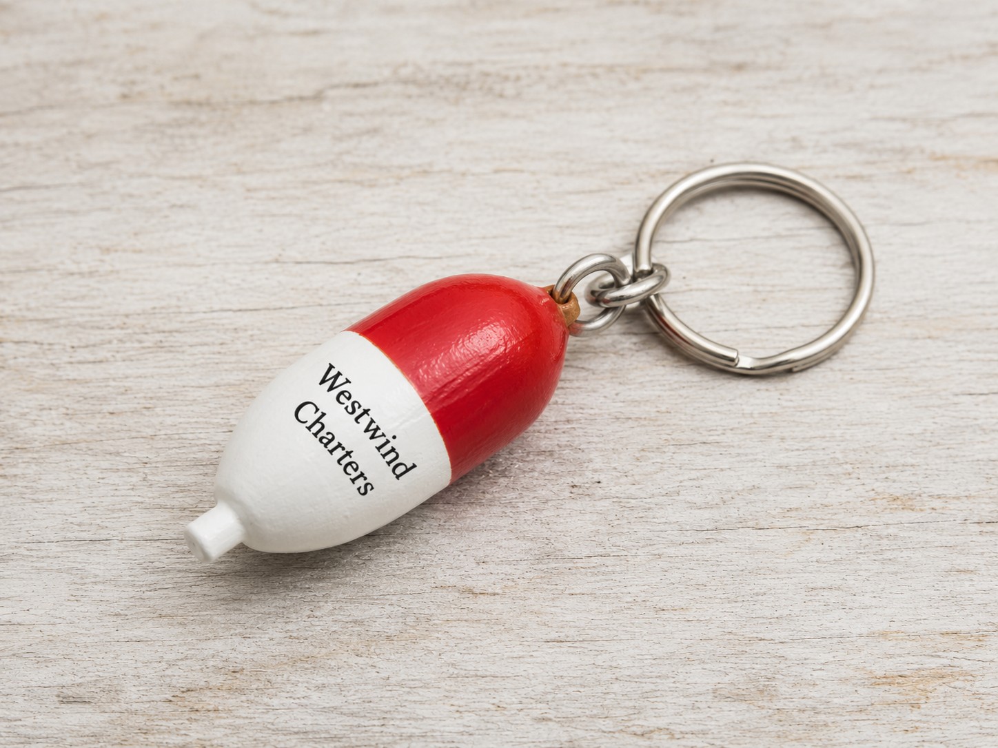 Wood buoy-shaped custom boat keychain with engraved branding